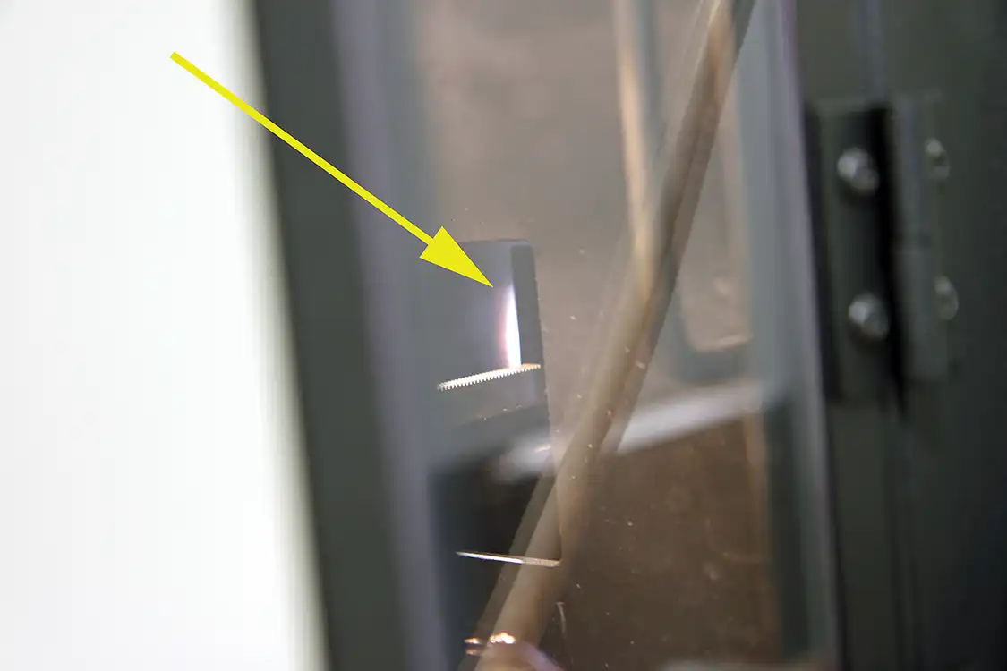 14. An electric plasma bolt using RDE technology takes place inside the Spectrometer (see arrow) to burn the oil and measure the sample to determine the elemental makeup of components in the oil.