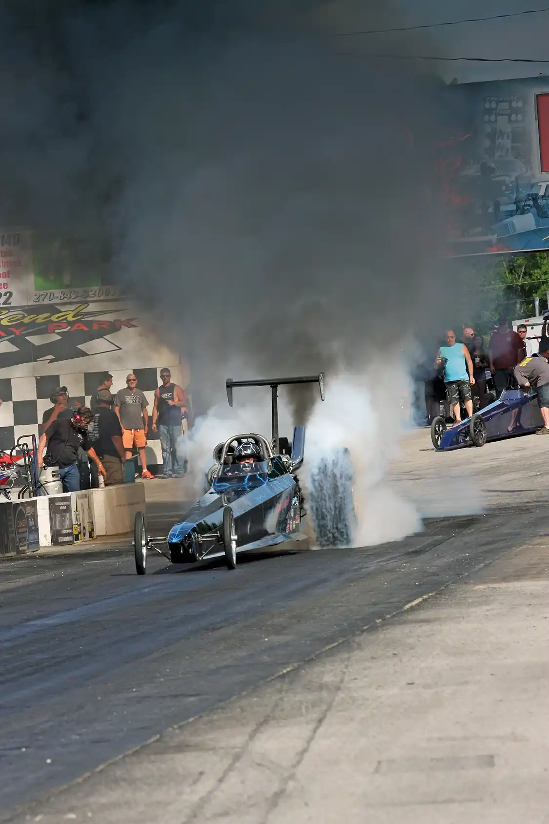 Jared Jones heats up the tires before making a pass in the Scheid Diesel dragster. He went over 200 mph while flying down the track.