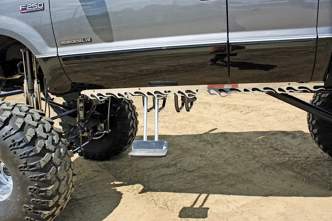 Long-reach motorized swing-down side steps are used to get into the big truck, while the flamed pinch weld covers improve the very visible look of the bottom of the cab.