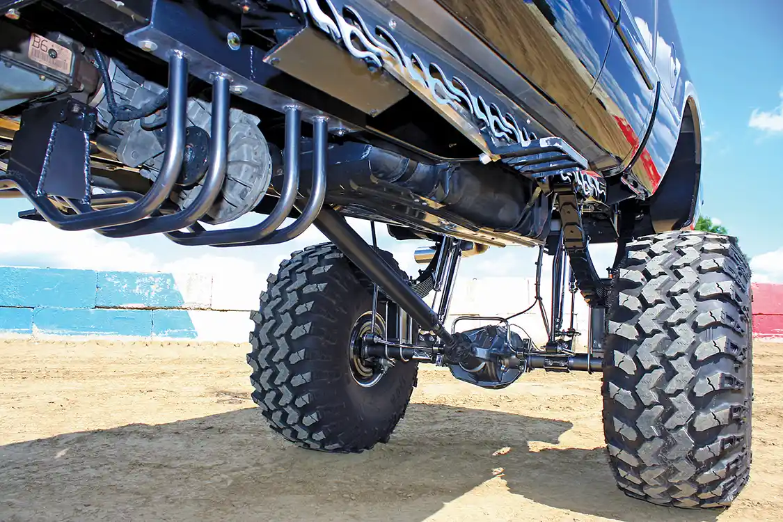 Looking under the truck you can see the custom transmission mount and integrated transfer case protection, along with the complete suspension system.