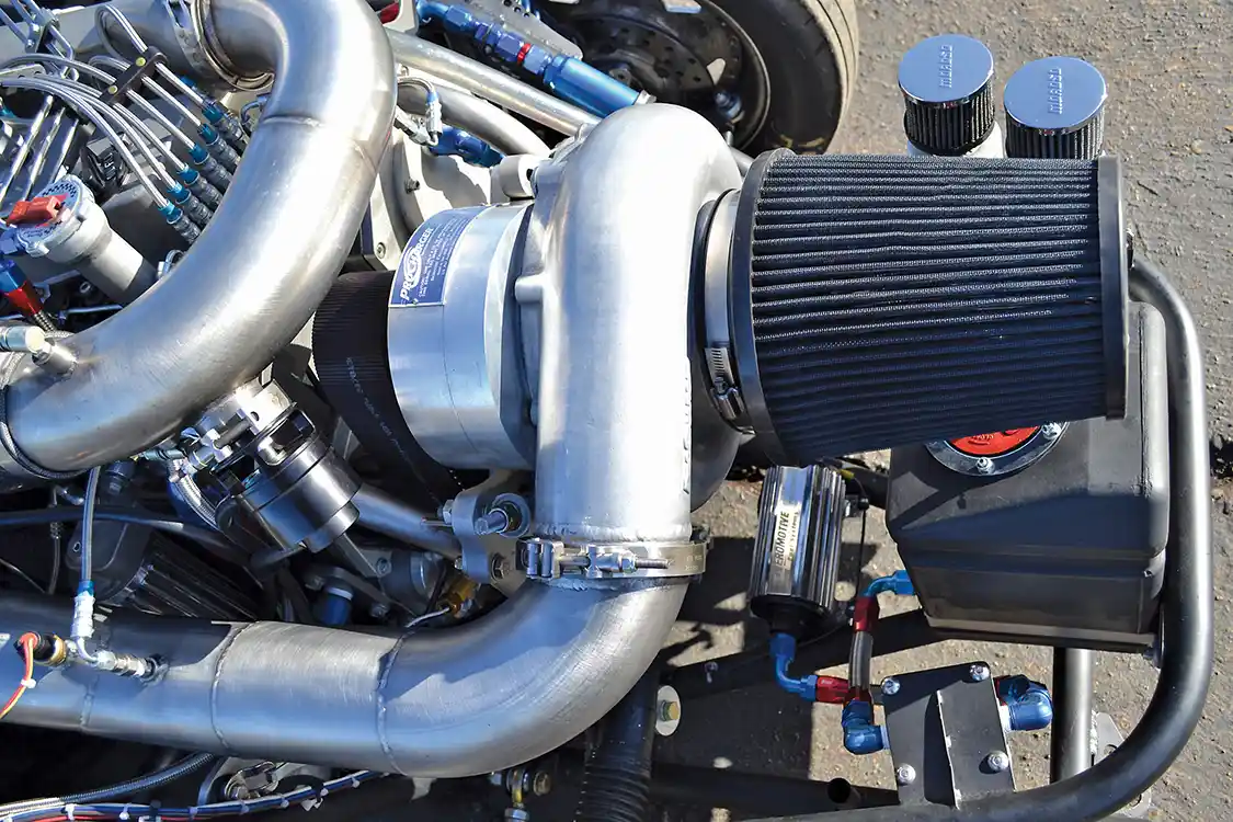 The heart of what makes this truck different is the enormous 139mm F3R Procharger. The reverse-rotation blower was mounted with a drive system of Brad's own creation that he fabricated in his shop, <a href="https://breannahopeponci.wixsite.com/poncisdiesel?fbclid=IwAR1jRLaEBgo2lVlQDsnIo4twSh-SVgPjj4Ga7Lopb5Thit6B6WXdSlkRcco">Ponci's Diesel</a>.