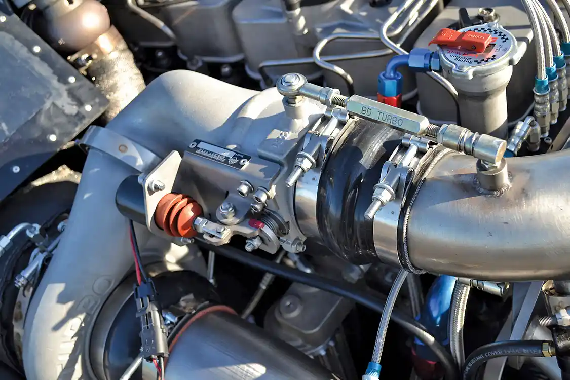For the safety of the engine, high strength boots, clamps, straps, and an air shutoff are incorporated into the intake tract in case a failure should occur.