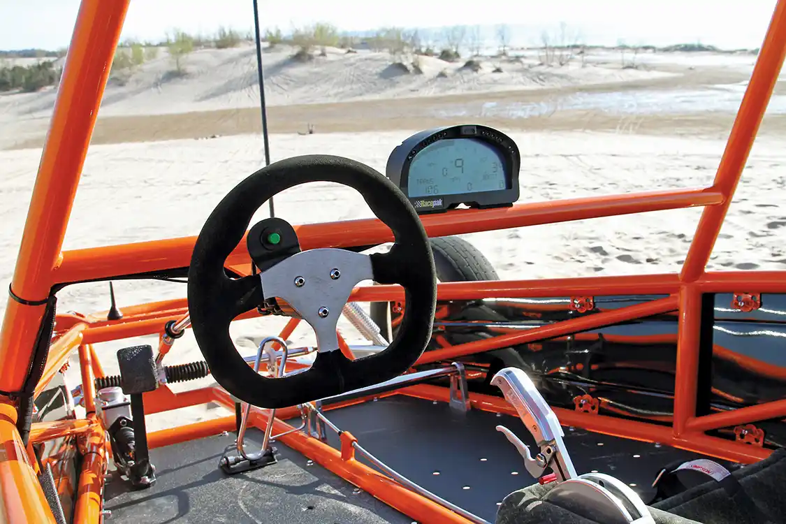 Driver necessities like the D-shaped 3-spoke steering wheel, Racepack gauge cluster and B&amp;M shifter handle are all within easy reach and view to keep the driver occupied four seconds at a time.