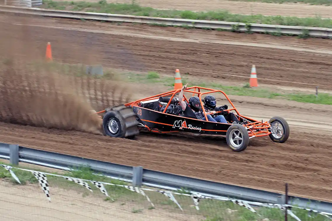 At Merchant Automotive’s annual Battle of the Diesel’s event, a satisfied customer takes the ride of his life in the passenger seat.