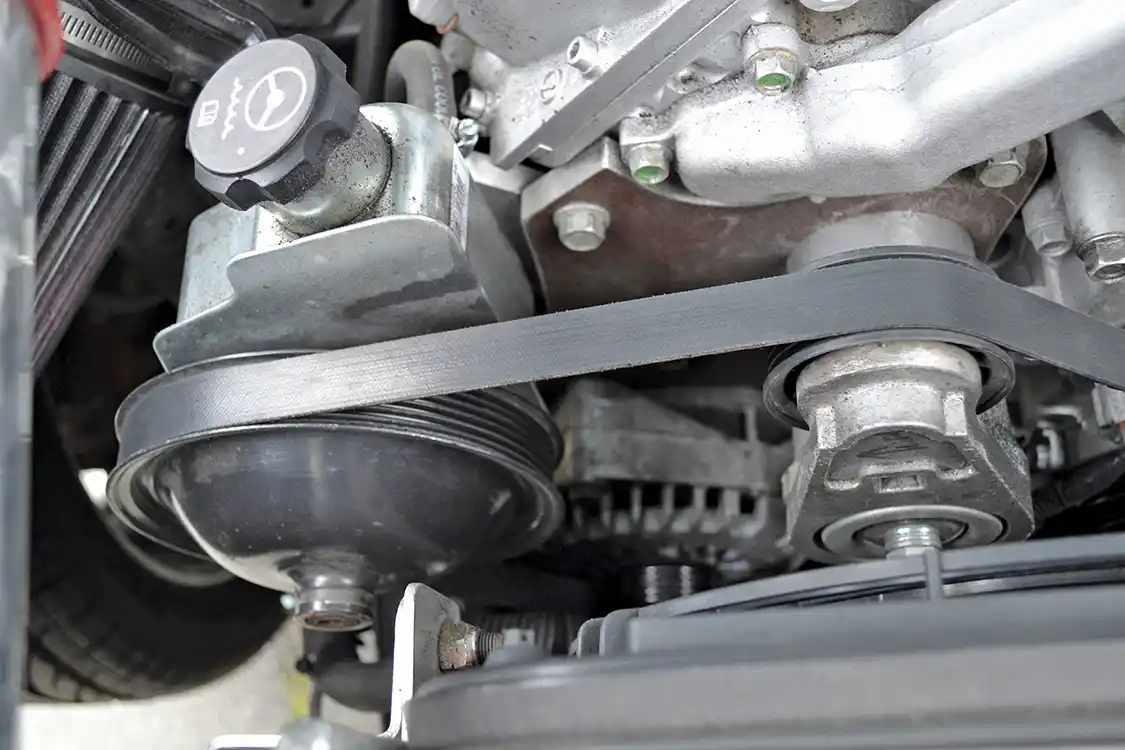 Another addition to the engine bay that helps out in the looks and power department is this low-mount drive bracket that Bill came up with. It deletes the A/C and also moves the steering pump down lower, so more of the engine is visible.