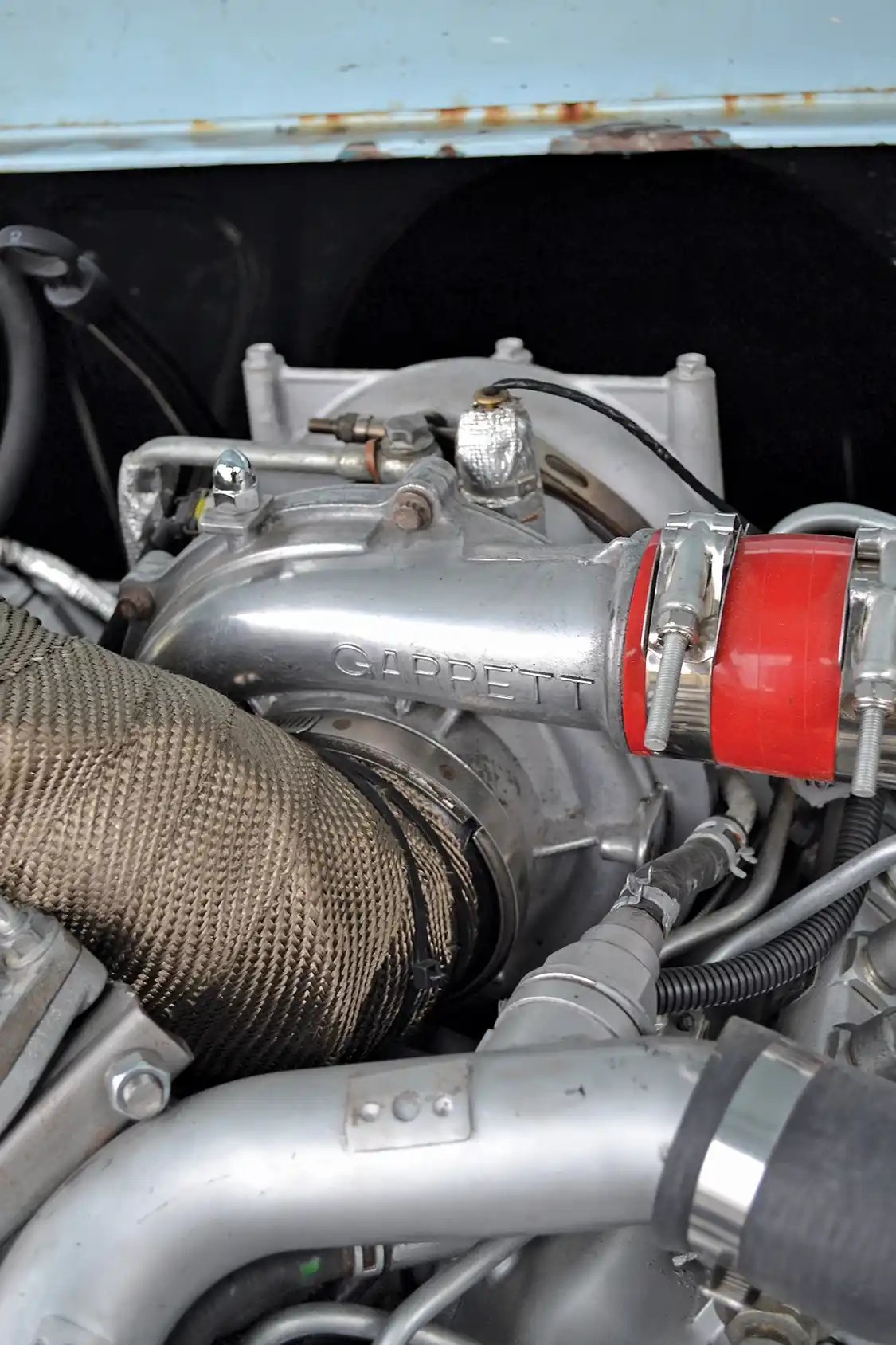 The stock Garrett turbocharger has been upgraded with bright red silicone boots and a heat-wrapped intake, but otherwise is stock, and puts out around 25 to 30psi of boost.