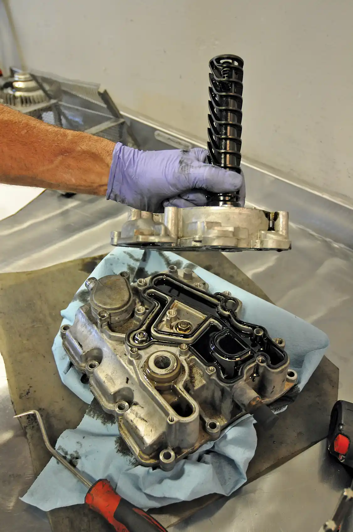 8. The oil cooler assembly comes apart in multiple pieces.