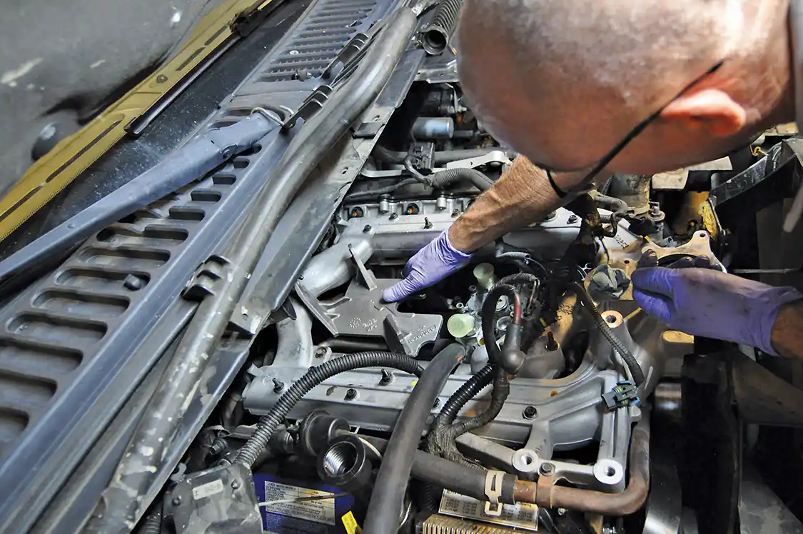 16. With the Bullet Proof Diesel EGR Cooler in place, the intake and turbo pedestal were installed. Notice the attention to detail BPD takes: Del Wamsley even sand blasted the pedestal and hit it with a good coat of <a href="https://www.wd40.com/">WD-40</a> to prevent any rust.