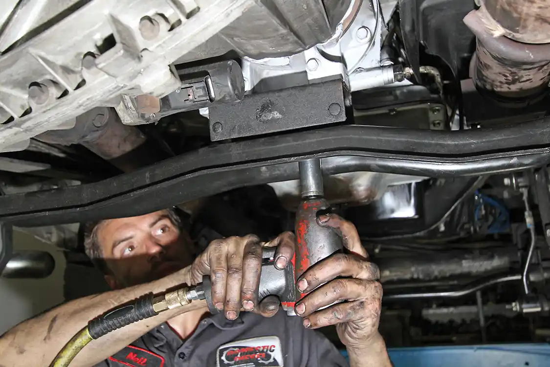 11. The transmission mount is bolted to the back of the 4R100 transmission. This mount is then tightened to the rear transmission cross member.