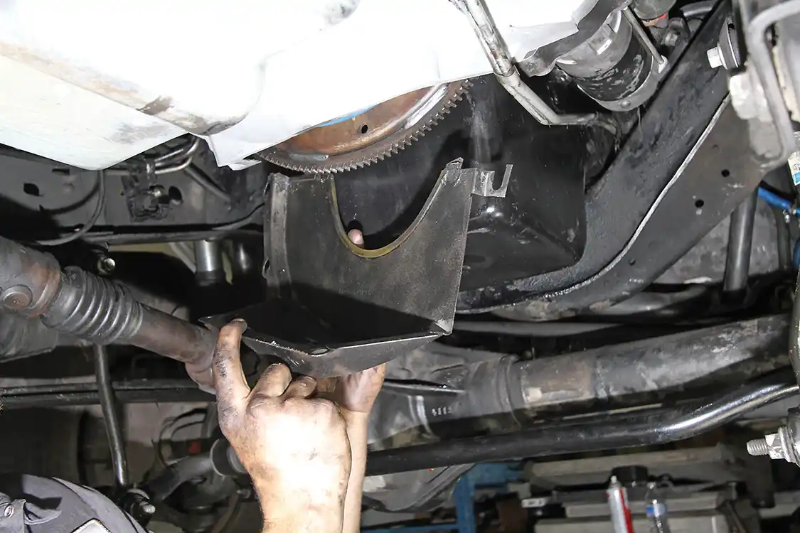 12. Always be sure to reinstall the dust shield at the bottom of the bell housing.