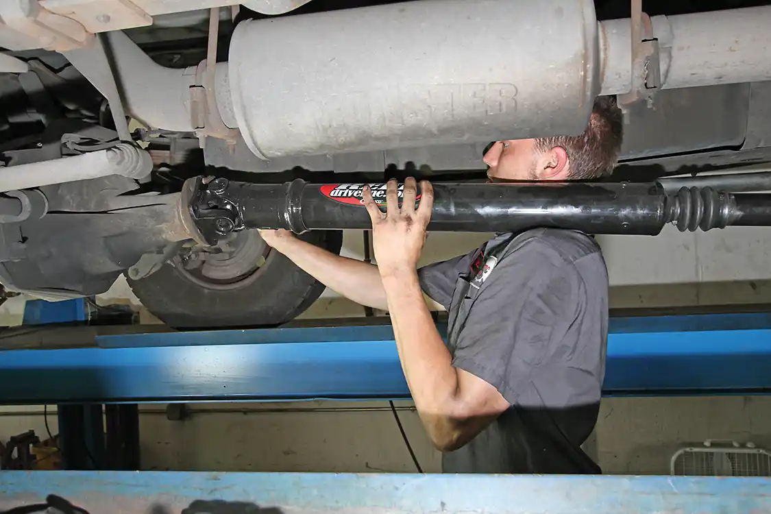 13. The rear driveshaft is a two-piece unit with a center support bearing. Ours was well used and in need of repair. It was replaced will an all-new unit from <a href="https://www.reeldriveline.com/">J.E. Reel</a>, which is better than stock.
