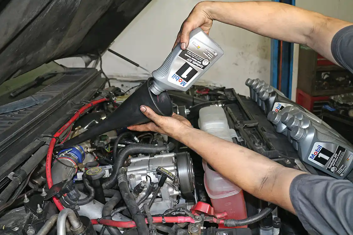 15. The transmission must be filled with 10 quarts of the correct type of automatic transmission fluid and then rechecked and topped off after starting the engine and putting the transmission in gear a few times to circulate the fluid throughout the system.
