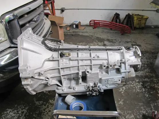 2. The basic transmission will need to be bolted to the transfer case for our 4x4 Ford.