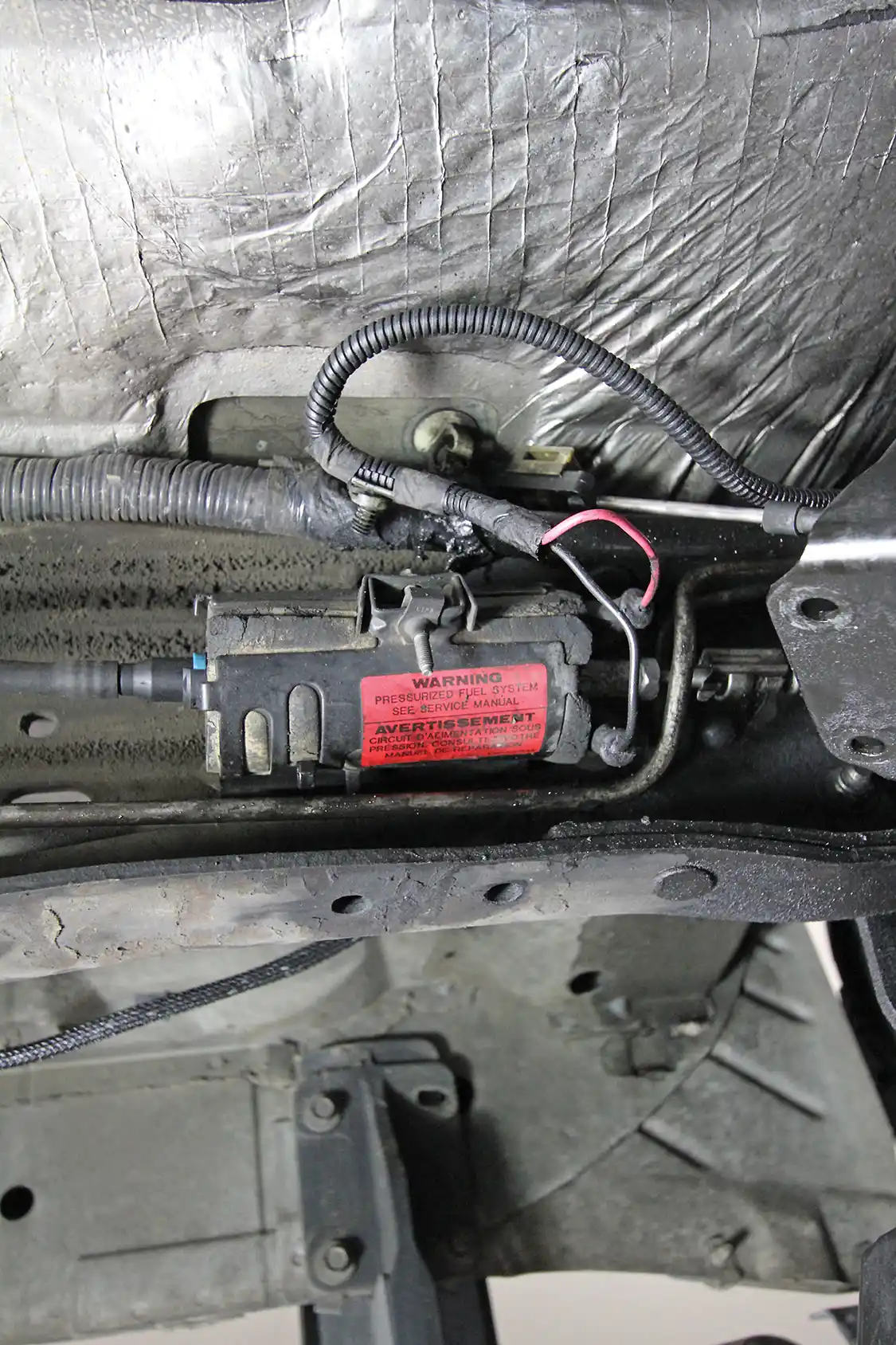 7. A tip for doing the transmission installation yourself: The fuel pump on the frame is easier to access with the transmission out. If your truck is a high miler, you might want to replace this pump now for added insurance down the road.