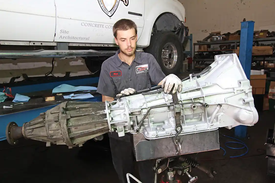 8. The transfer case should be bolted to the transmission while you’re outside of the truck. It is simpler to do this now than in the truck with the floorboard in the way. 