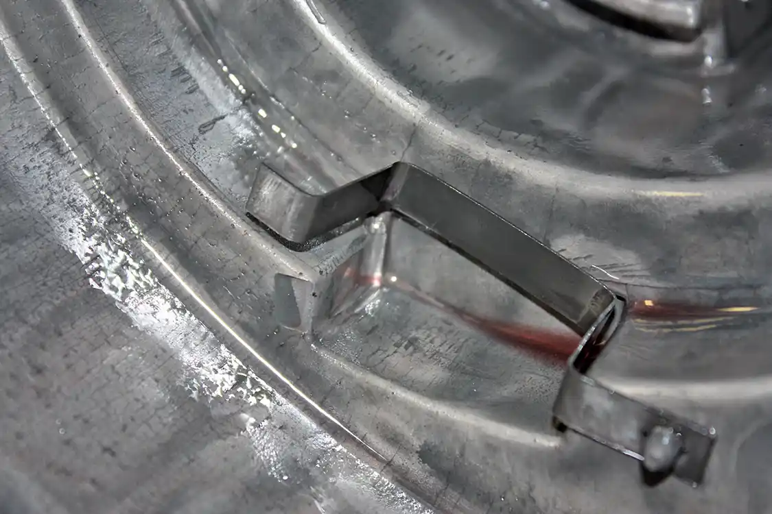 15. This shows the inside of the rear case where the transfer case pump housing rubs. This transfer case has just rolled over 150,000 miles and is definitely showing signs of rubbing. While the metal clip is still intact, by rotating it out of the way, you can see how the knife-edge-sharp pump has been pressing it into the outer case and has started to wear and round out the case. It’s only a matter of time before this would’ve worn all the way through, creating a leak and possible catastrophic failure.