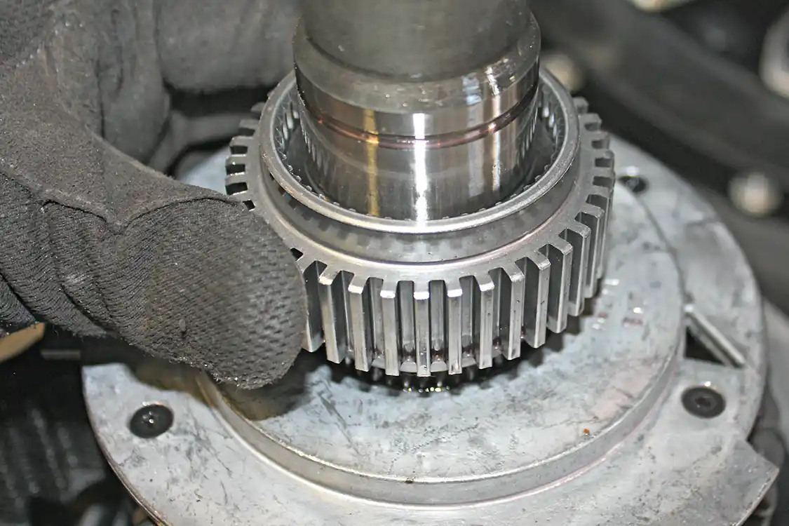 20. The rear gear will then be removed; pay attention to its orientation on the shaft as one side of the gear as a stepped end and the other is flat. The gear will need to go back the same way, so the gear and bearing will seat properly.