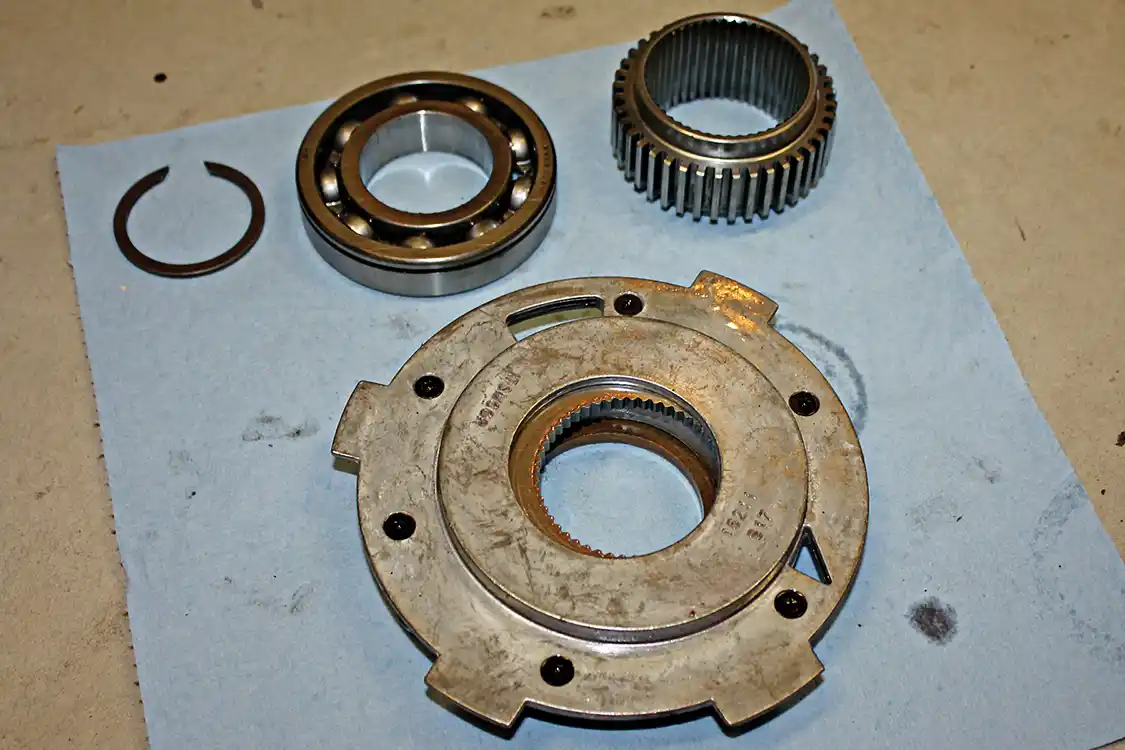 21. To remove the pump, the pick-up tube will need to be gently pulled out of the pump and the O-ring saved. Once the tube is out of the way, the pump can then be slid off the tail shaft as well.
