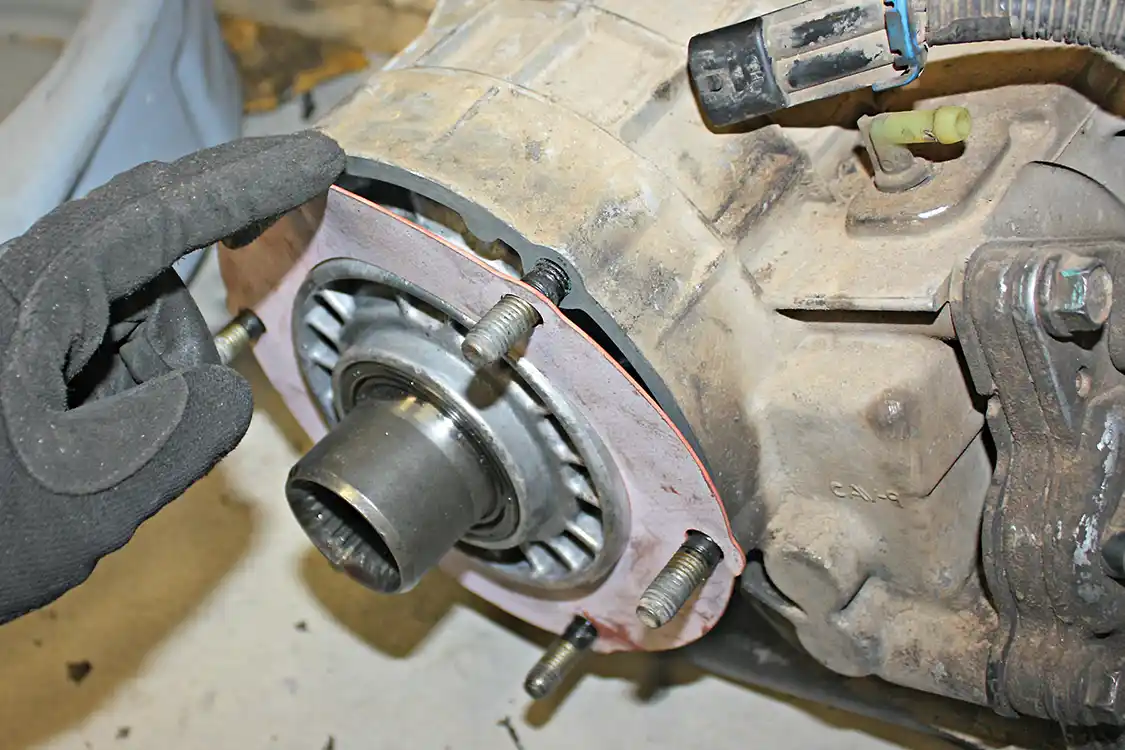 25. Once the cases have been put back together, the outer bolts can all be installed and torqued to 27ft-lbs in an alternating pattern. This will apply an even force all the way around the cases and create a tight bond for the silicone to create a leak-free seal. The PPE kit does include a new transfer case seal to keep the mating surface between the t-case and transmission leak free as well.