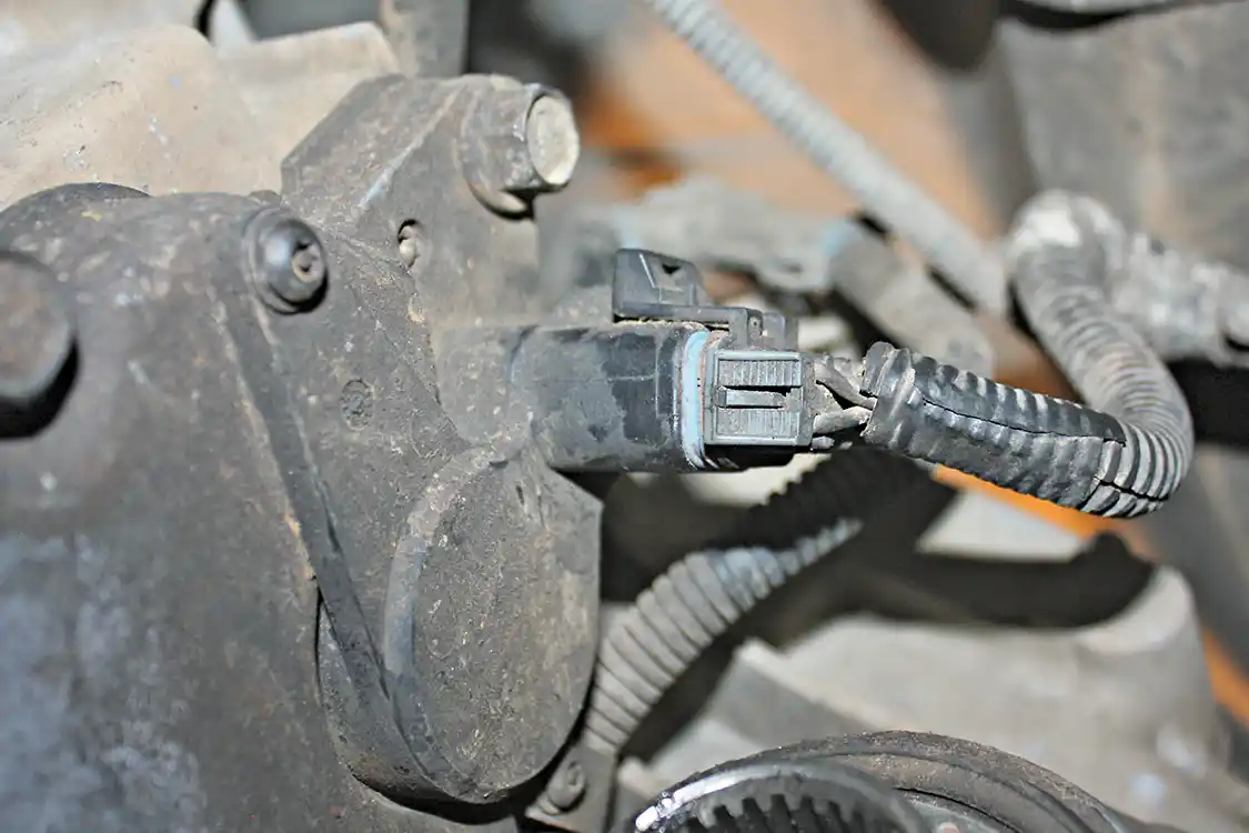 6. The next step in the removal process is to disconnect all the electronics, like this one shown plugged into the electronic shift selector. There are also a couple cables that are mounted to the transfer case that will need to be removed.