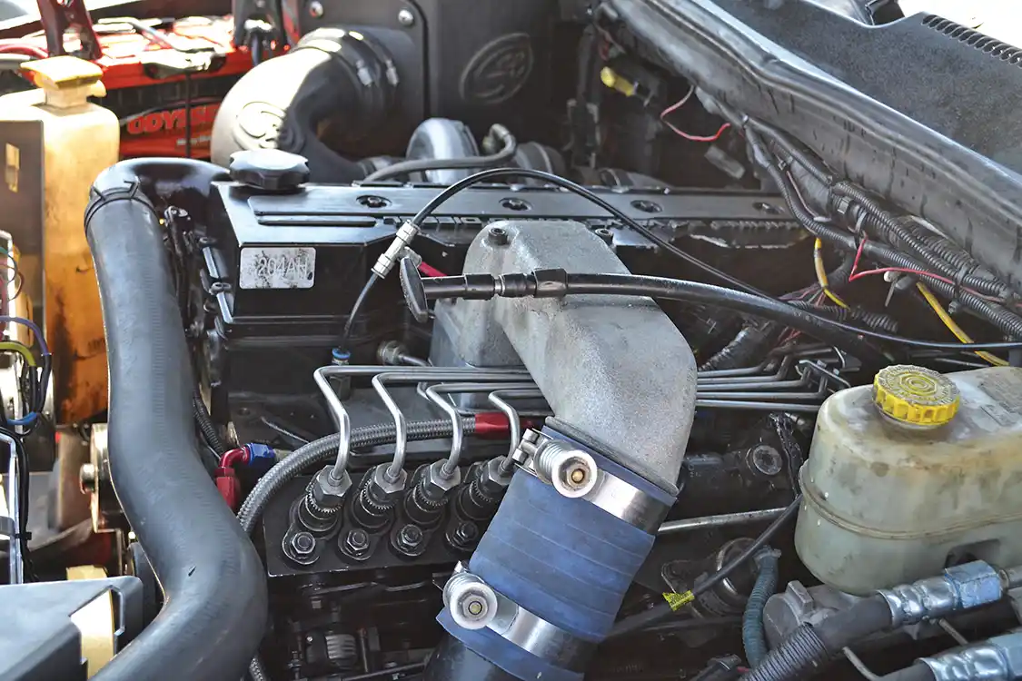 While waiting for the sled pulls to start, we got a chance to look at some cool engine bays. Joel Gooch from J&amp;H Performance was nice enough to pop the hood on his ultra clean sled puller so that we could check out its p-pumped 24-valve power plant.