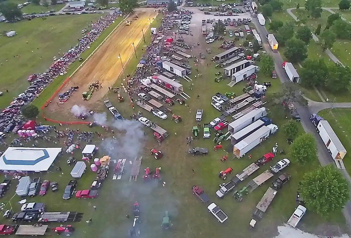 With 31 classes, (spread throughout three sanctioning bodies) two sleds running nonstop, and more than 200 hooks, there was never any shortage of action at the annual 4th of July truck and tractor pull in Oquawka, Illinois. As of press time, we didn’t have the final spectator tally, but we do know the FFA concession tent sold more than 2,200 sandwiches, along with over 100 cases of bottled water.