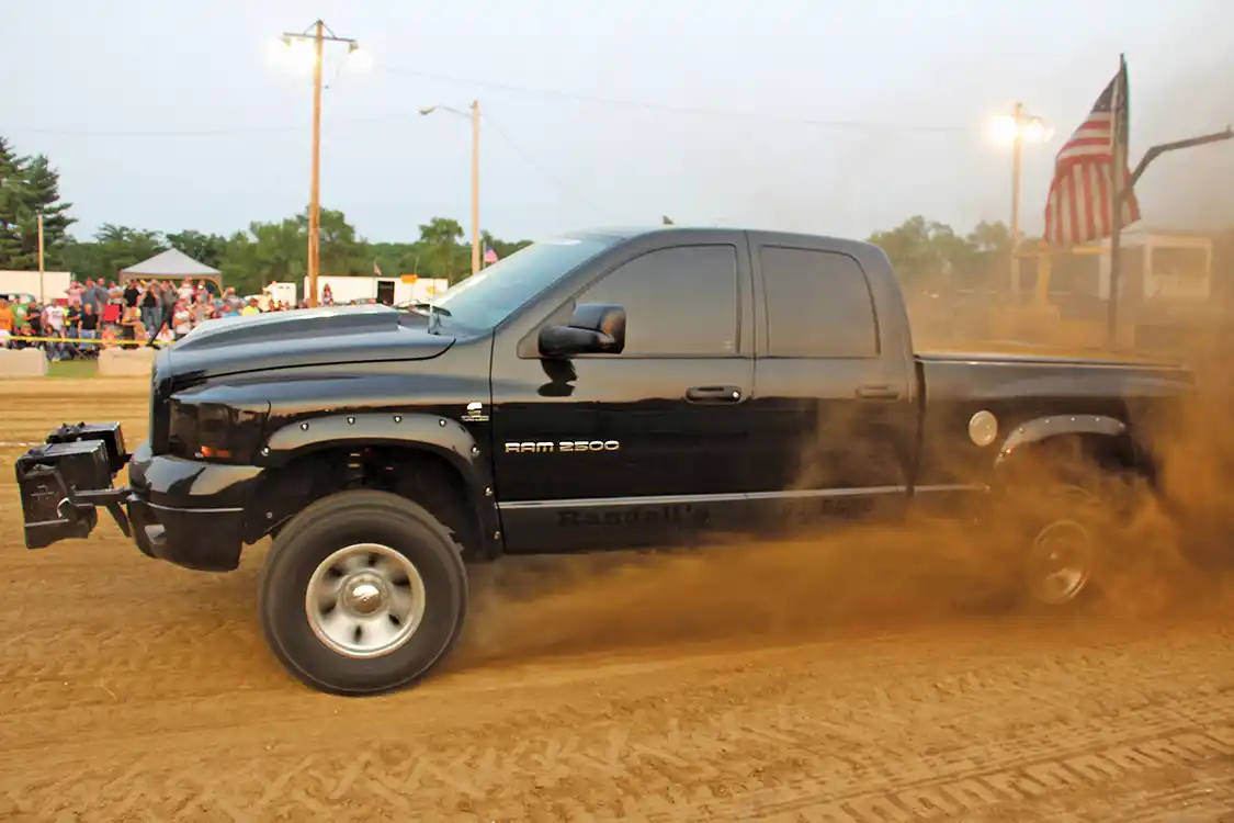 Despite not being able to get on top of the chargers until mid-track, Brian Randall’s 2006 Dodge still managed to yank the sled 323 feet—good enough for Third Place in Open Street. His triple-turbo Ram lays down more than 1,100 hp on the chassis dyno and has run a 10.69-second quarter-mile.