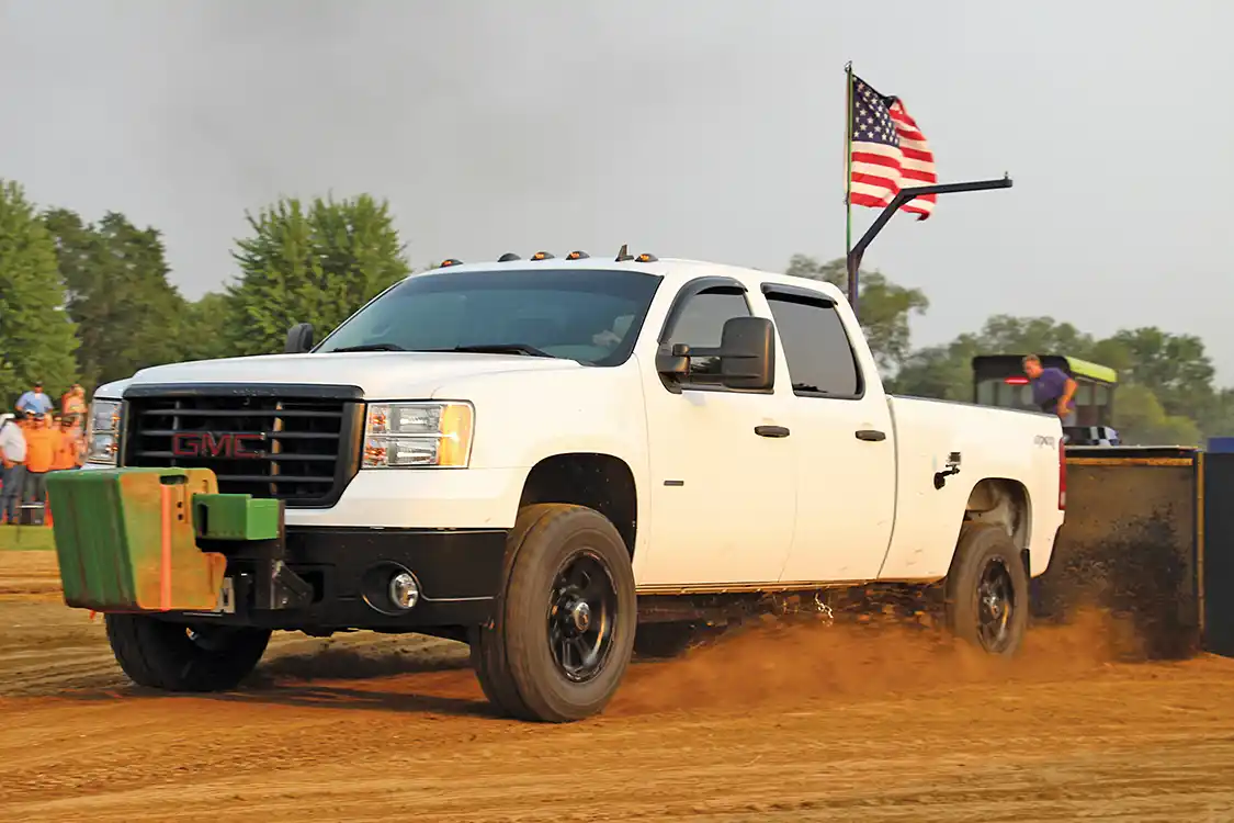 Kaden Nelson’s compound turbo’d, 650-hp 2009 <a href="https://www.gmc.com/">GMC</a> made a good pass in the Open Street Class. Unfortunately, he hooked just as the evening moisture was beginning to rise to the track’s surface. The result of the added bite cost him his rear driveshaft—still, a small price to pay in the sled pulling game.