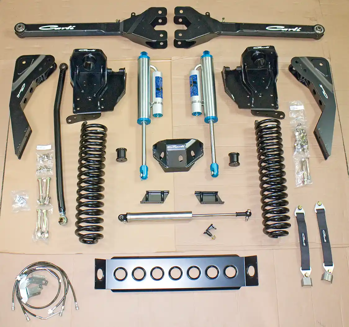 1. Here you see the front components of the <a href="https://www.ford.com/">Ford</a> F-250 lift in these pages. This is the full Dominator 3.0, 4.5-inch lift setup. The front upgrade included new <a href="https://www.kingshocks.com/">King</a> remote reservoir shocks, longer springs, new front coils, coil buckets and much more.