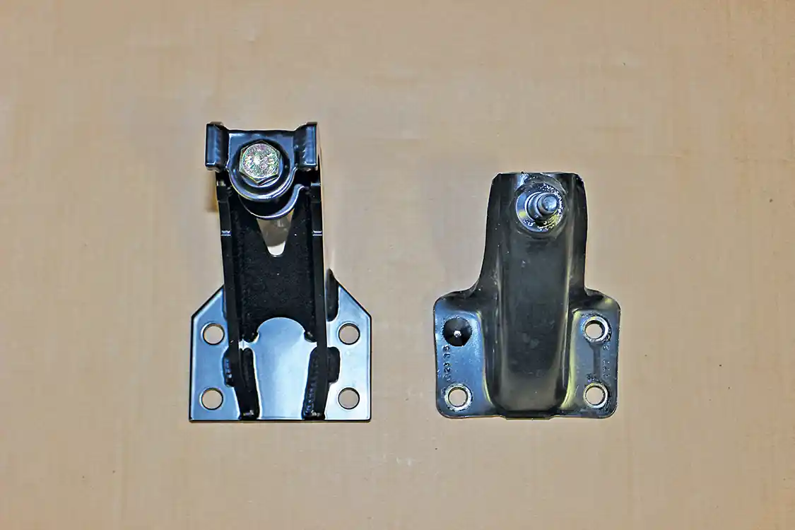 13. Here you see the new Carli rear shock mount (L) compared to the OEM mount. The OEM mount must be cut off the frame since it is riveted.