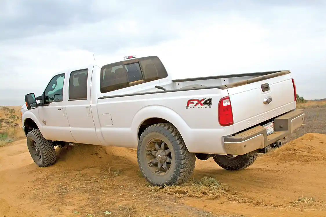 17. On the opposite side, you can see just how much “up-travel” the Carli kit offers. This 37-inch tall tire is stuffed into the wheel opening, with just enough clearance to prevent grabbing the wheel openings. This size tire won’t even fit on the truck, with the OEM suspension; here it fits even with the suspension flexed out.