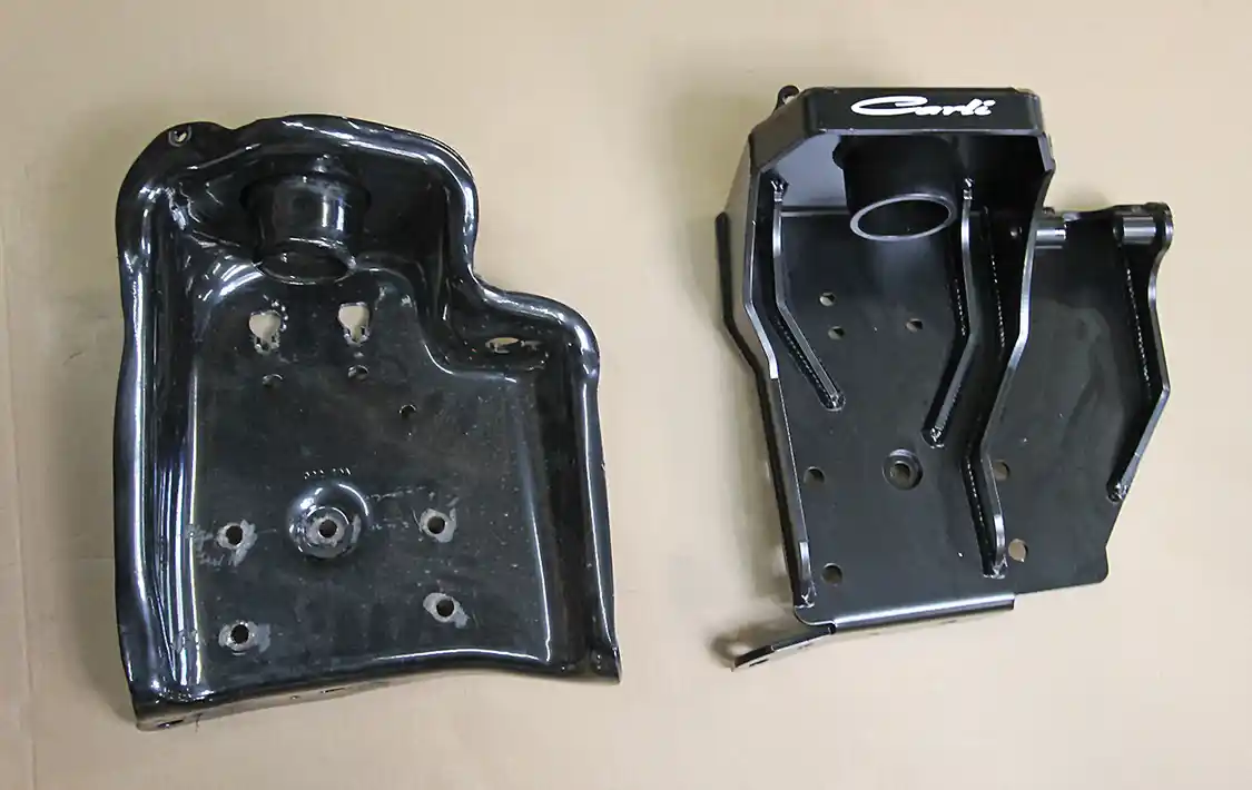 3. Note the OEM upper spring and shock bracket (L) compared to the new Carli unit. While similar in look, the Carli bracket allows the use of longer coils and shocks.
