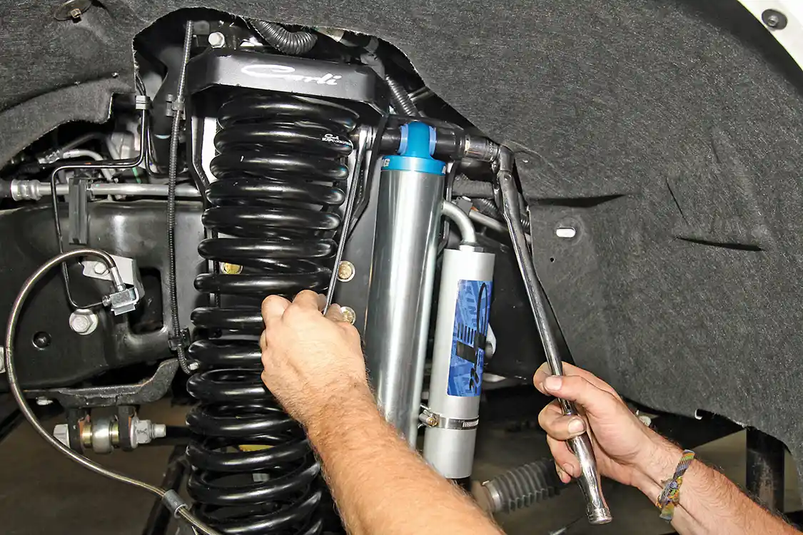 7. With the longer coils in place, the front King remote reservoir shocks are installed. This combination will ride smoother and have more travel, offering your rig more tire and trail clearance.