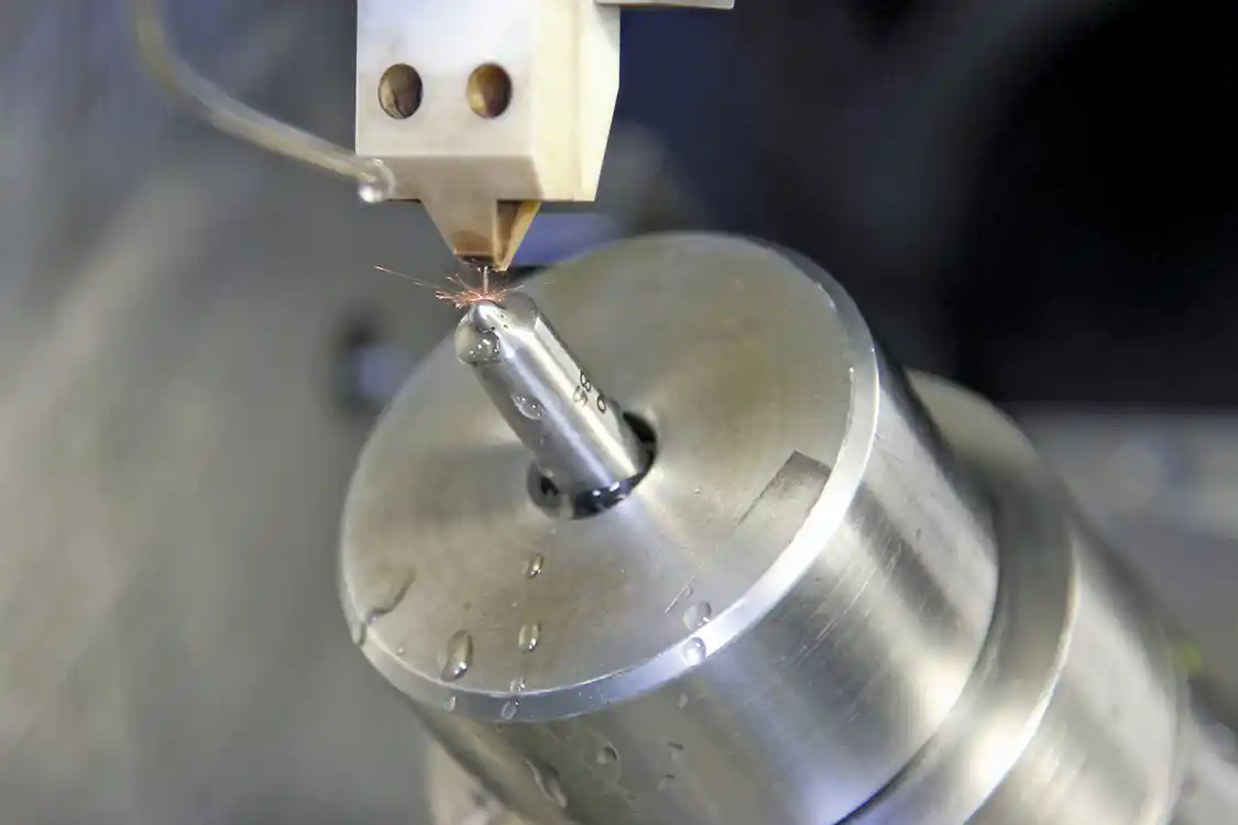 3. With the fluid flow shut off, you can see the sparks as material is removed from the nozzle.
