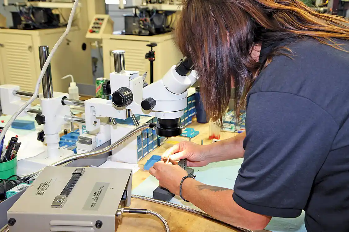 5. Ruth also inspects the outside of the nozzle tip under a microscope to make sure that there are no problems with the machining.