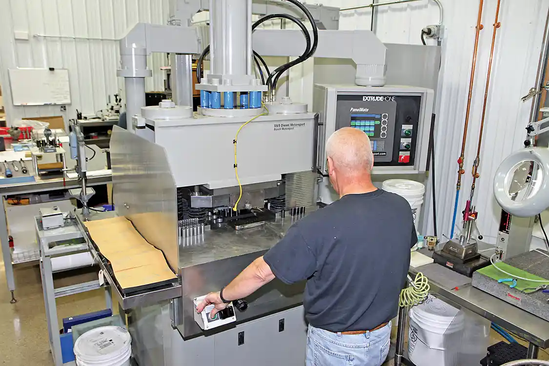 10. Greg Spoolstra operates the AFM machine to show us the process S&amp;S nozzles go through.