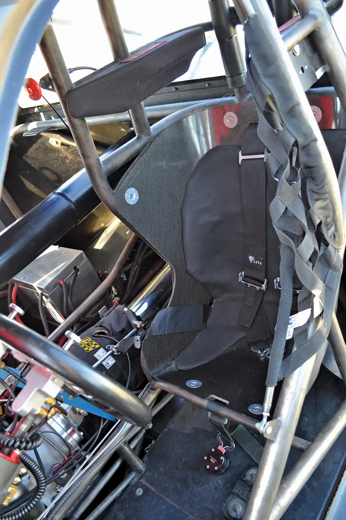 A race weight of 2,850 lbs. doesn't come easy, and weight is cut wherever possible. Even the seat is a half-seat, and it's made out of carbon fiber.