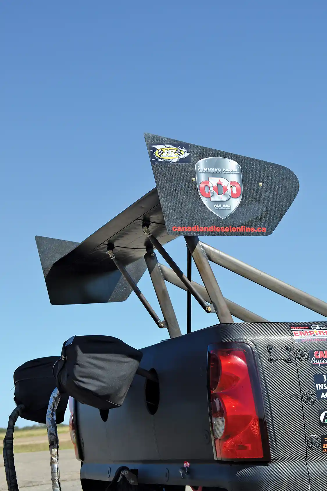 The team is aiming high when it comes to performance. The rear wing is a Top Fuel-style unit that provides an awesome amount of down force at the top end of the track to keep the truck straight, while the dual parachutes are an <a href="https://www.nhra.com/nhra">NHRA</a> requirement in case the truck tops 200 mph in the quarter-mile, which is a very real possibility.
