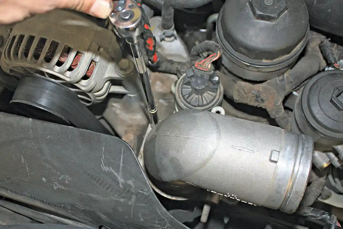 9. The factory intake elbow is then removed to make way for the better flowing High Ram Elbow. The sharp tight bends inside the stock elbow aren’t conducive to good flow and upgrading can offer both better throttle response and improved mileage.