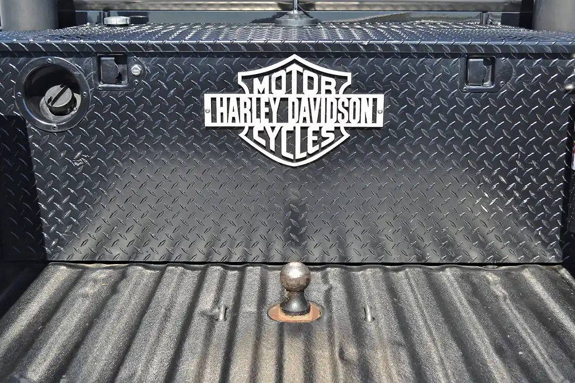 In the bed, a gooseneck hitch hints at the capability of Brig's Harley truck. The toolbox has even been modified with the installation of an internal water-methanol tank that helps the Harley truck keep its speed up when pulling long grades.