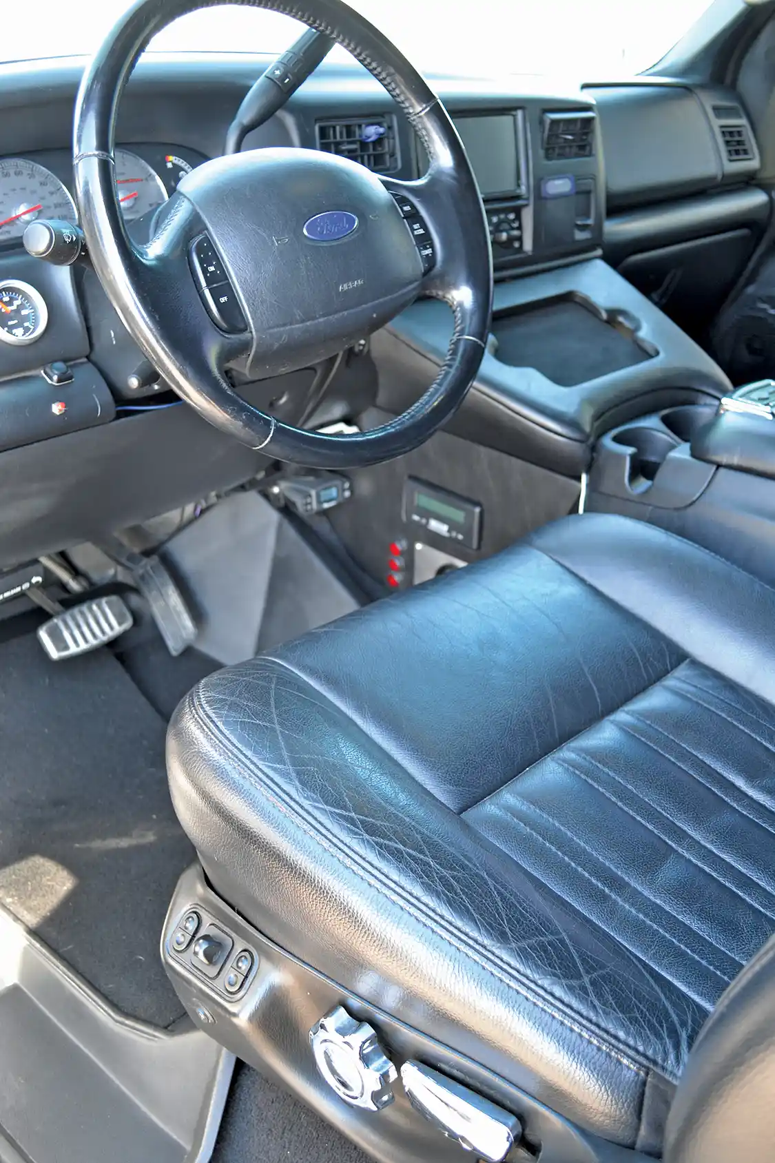 The interior of Brig's Harley truck is one of the nicest we've ever ridden in, and it hides a number of features that Brig integrated himself, with the help of his buddies at All Fab Inc.