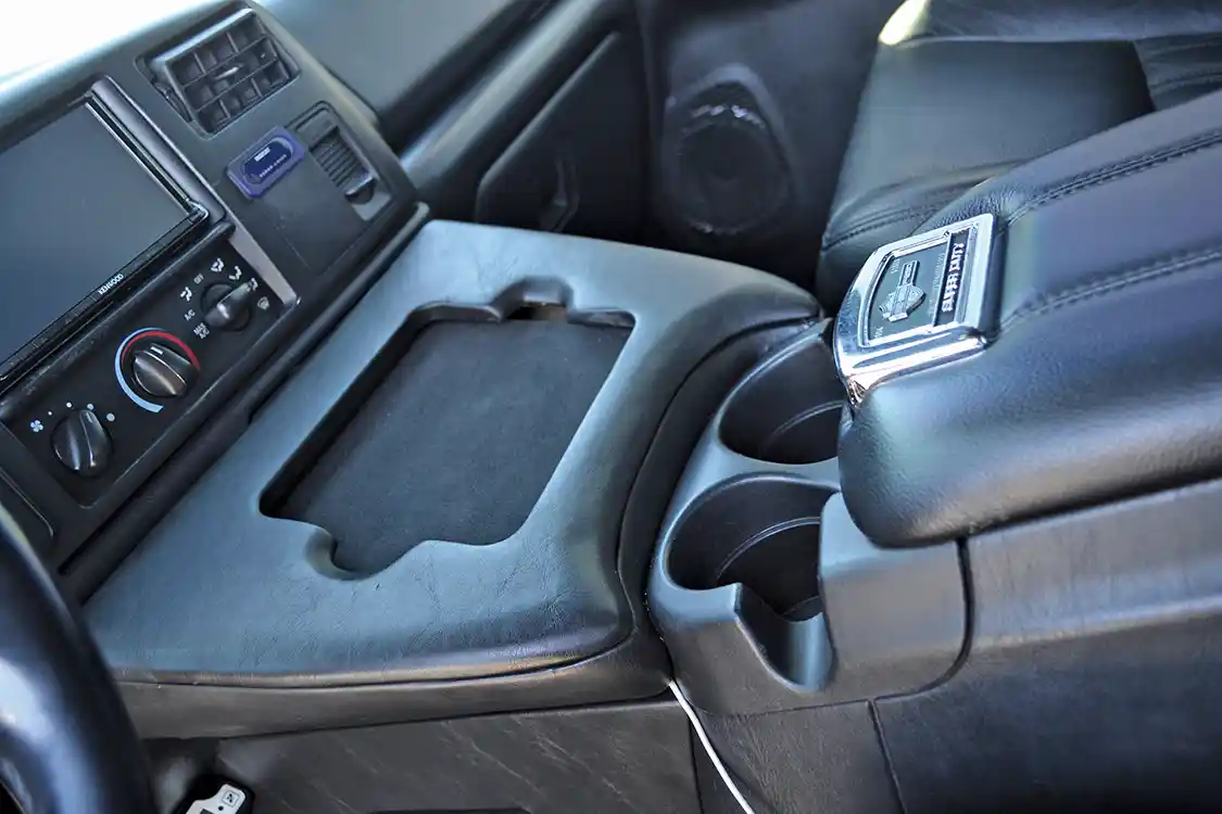 The rest of the interior also has a number of niceties that Bring incorporated into the build. The center console for instance, has this cool I-Pad holder so Brig can watch movies while he's towing (we're kidding).
