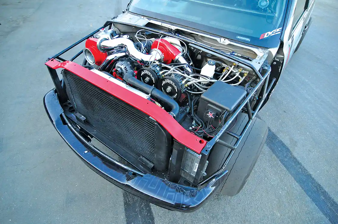 The current 6.6L Duramax features a <a href="https://winbergcrankshafts.com/">Winburg</a> billet crank, <a href="https://www.cp-carrillo.com/">Carillo</a> rods, forged pistons and is blueprinted and balanced. Industrial Injection race ported heads and alternate firing order cam also help it make big power and survive. Notice the triple Dragon fire CP3 pumps at the front to feed fuel to this hungry monster.