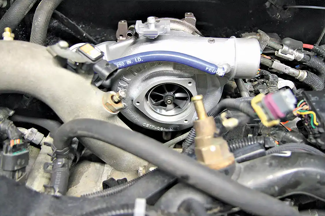 10. Once dropped into place, the Stealth 64 looks right at home in the engine valley and, to an untrained eye, it looks completely stock— especially once the intake system is bolted back on. The new compressor wheel offers a broad power and torque curve with a more pronounced whistle under the hood.