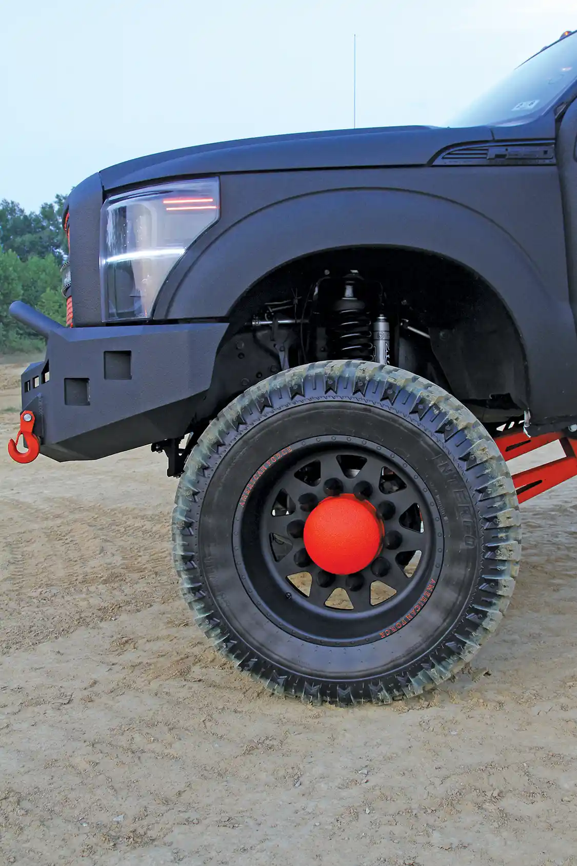 A massive set of American Force 22x12-inch Independence Super Duty wheels were powdercoated to match the truck’s exterior and they fit the build perfectly.