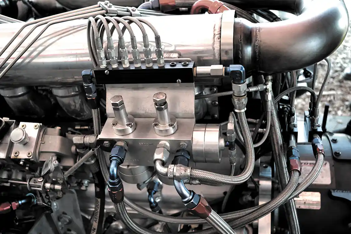 Early on in his racing career, John had a lot of broken parts from 2,000-plus degree exhaust gas temperatures. With the new engine, John wasn't taking any chances, and runs his 10 nozzle, 1,100-psi water injection system quite aggressively. With more than a gallon of water injected per 6-second pass, John's engine uses nearly as much water as it does fuel.