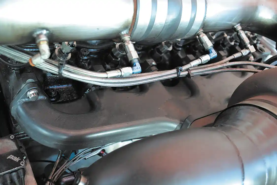 A <a href="https://steedspeed.com/">Steed Speed</a> exhaust manifold with a T6 flange is both larger, better flowing, and tougher than a factory Cummins exhaust manifold. For John's engine, it was the perfect choice.