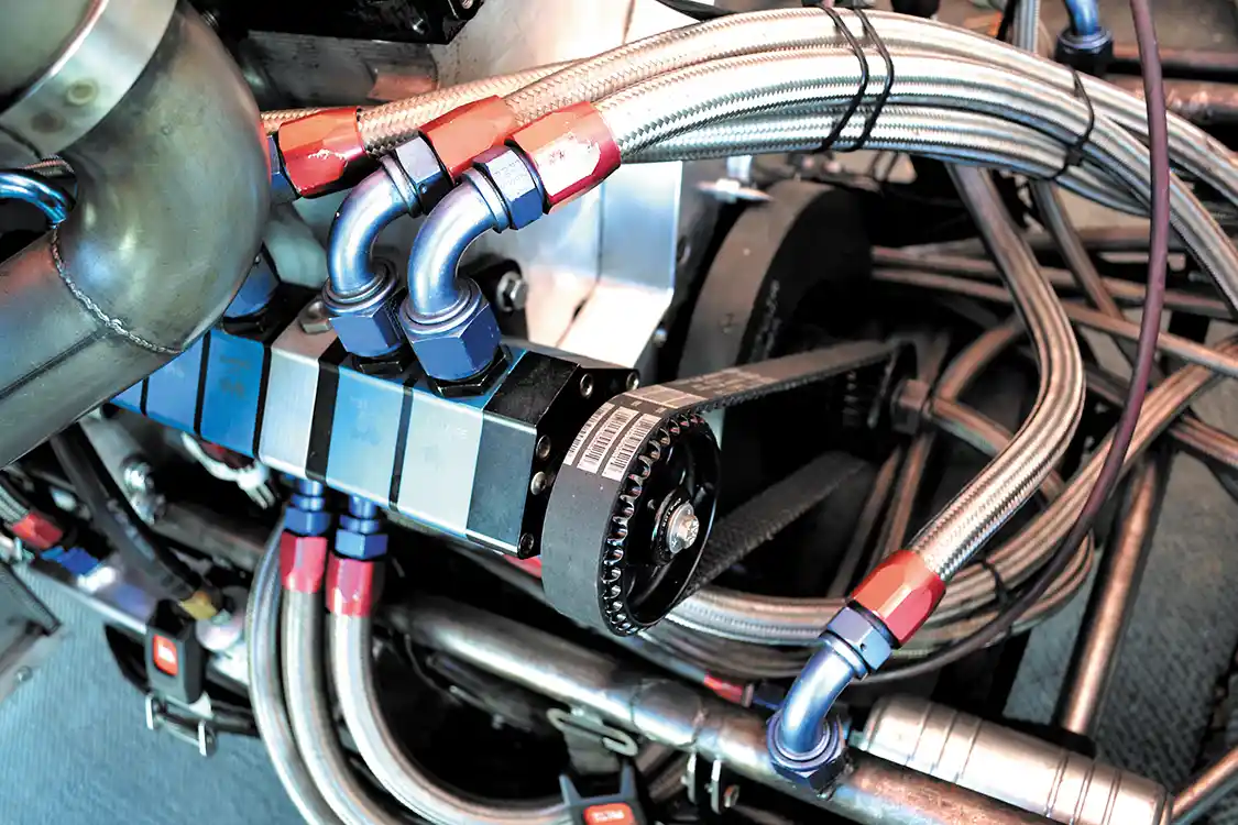 A dry sump oiling system keeps the oil pressure up no matter if the engine speeds are high or low. Also visible in the photo is the <a href="https://fluidampr.com/">Fluidampr</a> balancer that ensures happy and healthy bearing life even with consistent 6,000 rpm engine speeds.