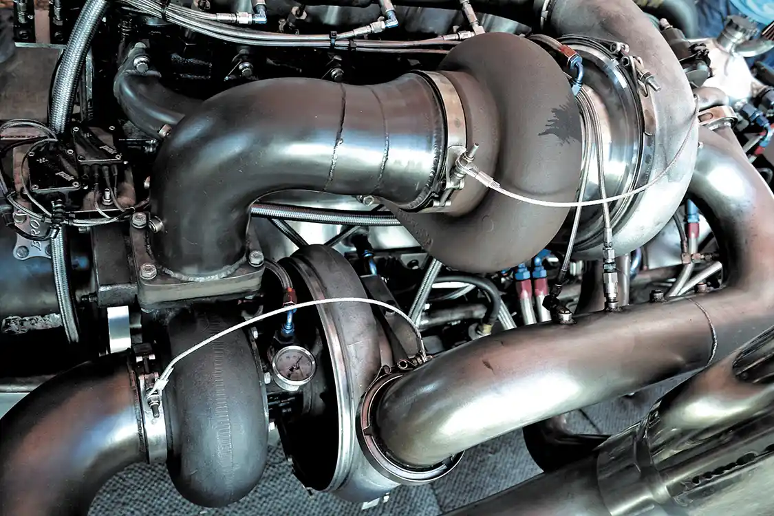 A simple turbo setup isn't in the cards when this type of horsepower is involved. Compound turbos combine to send 143 pounds of boost into the engine. The "smaller" of the two chargers is an 88mm turbo from <a href="https://www.precisionturbo.net/">Precision Turbo</a>, while the large turbo is a 114mm <a href="http://www.myholsetturbo.com/index.html">Holset</a> HX82-based turbo.