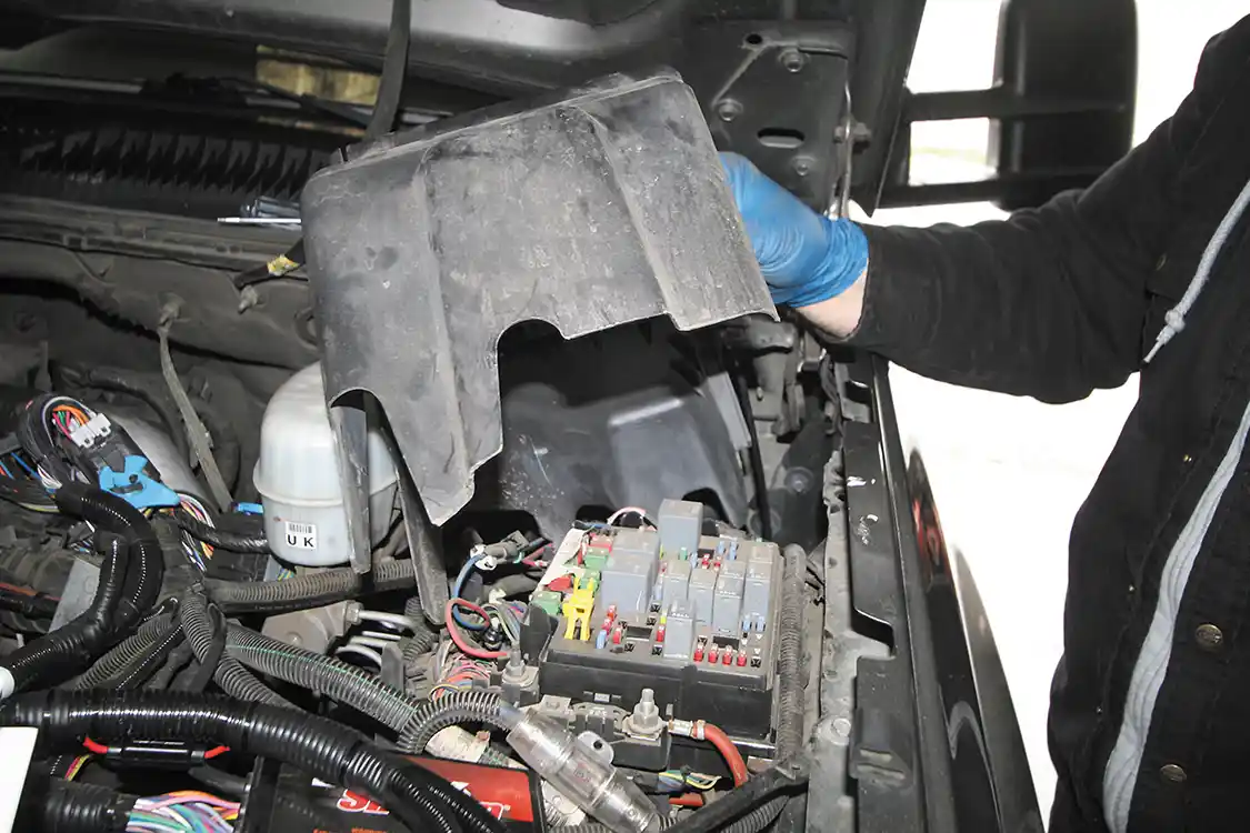 6. To gain access to the fuse panel, the cover must follow the removal of the panel bolts, so the fuse panel can be lifted up and out of the way.